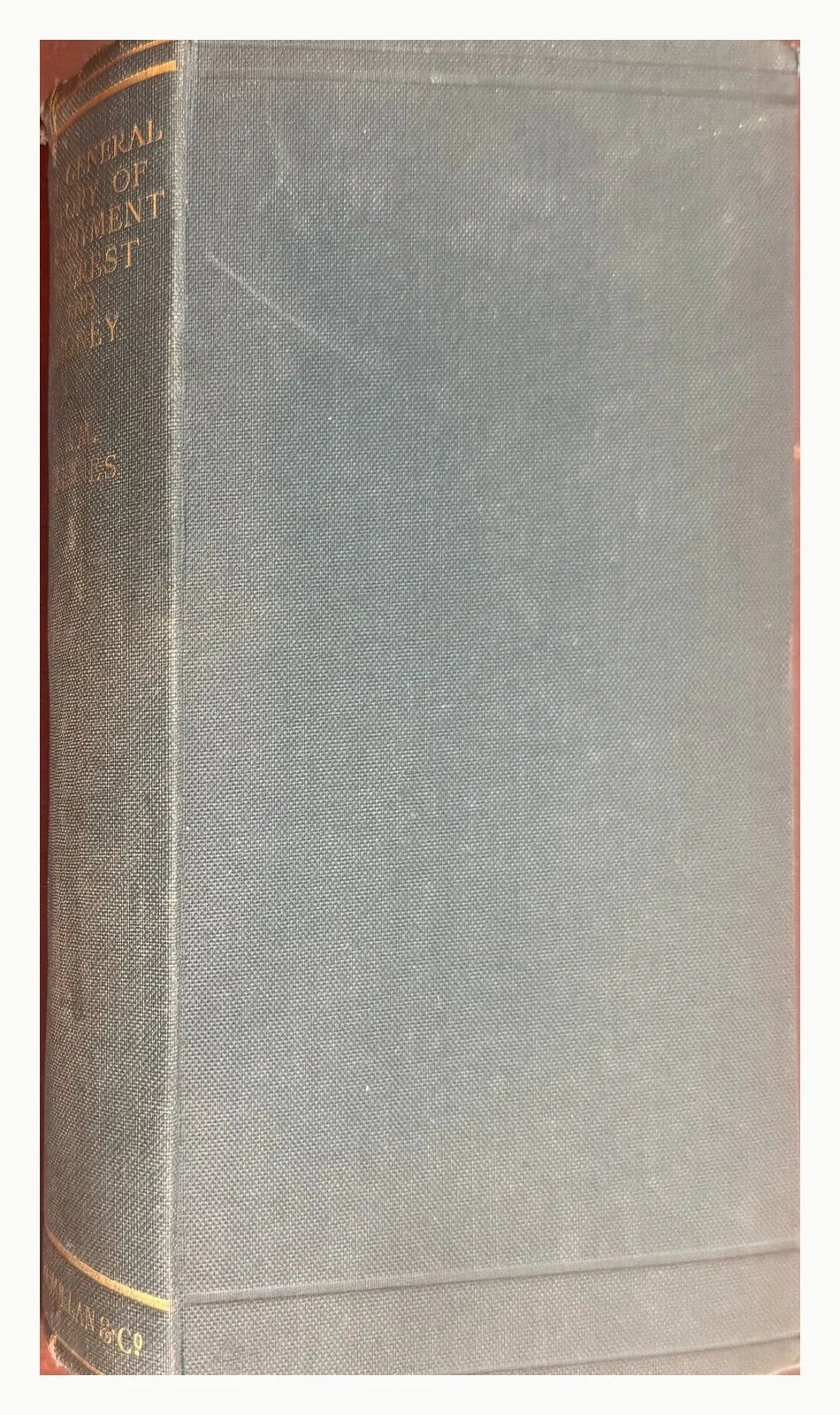 Front board of The General Theory in dark blue cloth